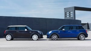 Two-door coupe and four-door sedan parked side by side