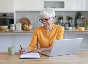 Senior homeowner reviewing property tax documents in the Dominican Republic
