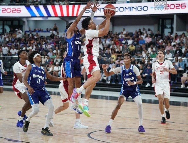 Dominican Republic player attacks the basket against Nicaragua at CAC Games