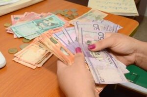 Currency exchange displaying Dominican pesos and U.S. dollars