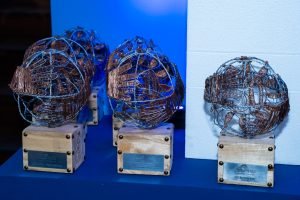 Dominican artisan creating a sustainable trophy from recycled materials