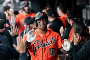 Rafael Devers celebrates after driving in the winning run for the Giants