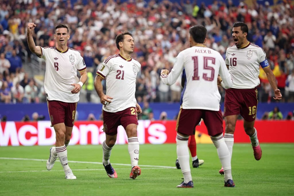 Spain players celebrate victory over France in World Cup semifinal