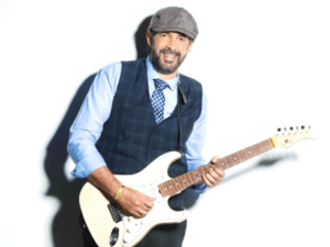 Cover presentation of a book about Juan Luis Guerra's career