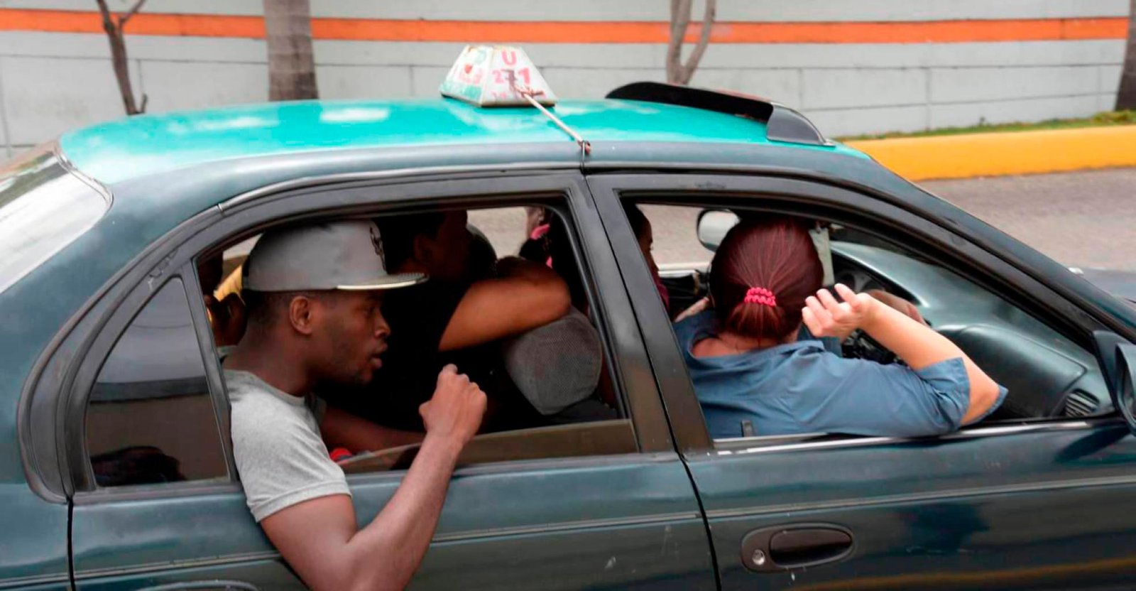 Citizens riding in a shared public transport car