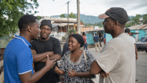 Dominican and Haitian residents interacting near the Dominican-Haitian border, illustrating long-standing Spanish and Haitian Creole language contact
