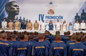 Dominican migration agents during graduation ceremony in Santiago