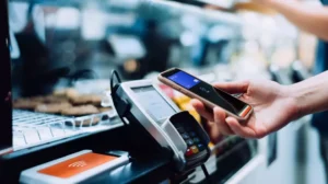 Customer making a contactless payment with a smartphone