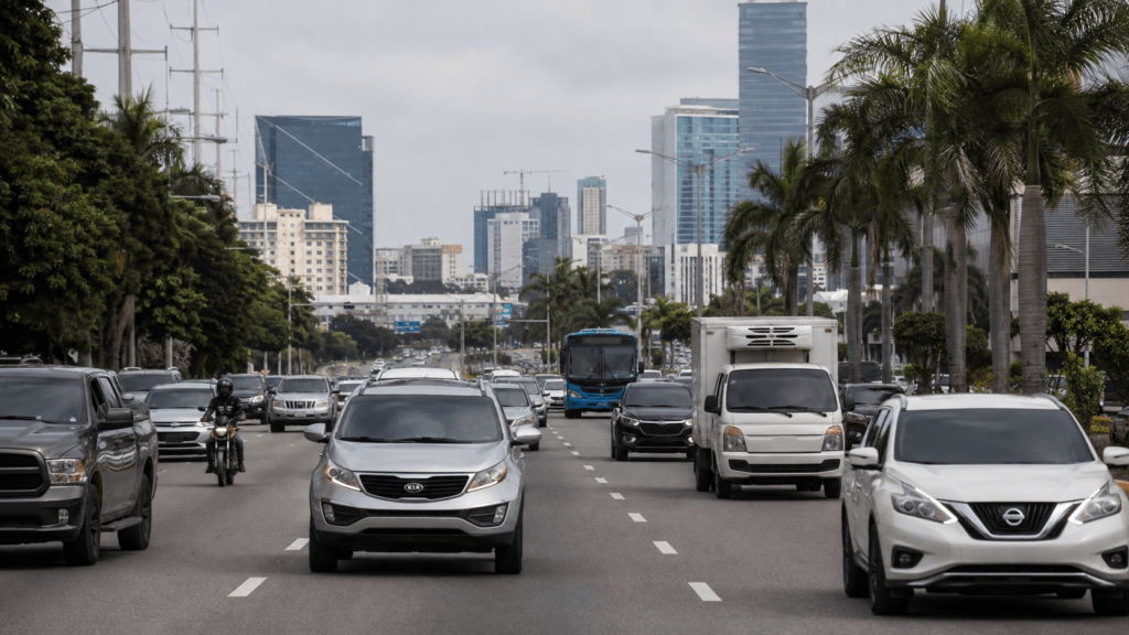 Vehicles traveling through a modern urban roadway in the Dominican Republic, representing the country's automotive industry