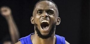 Dominican Republic basketball players celebrating a win over Brazil