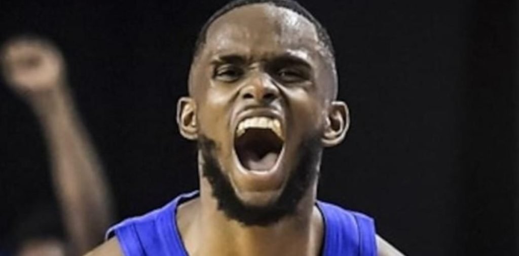 Dominican Republic basketball players celebrating a win over Brazil