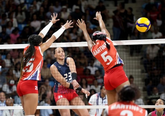 Dominican Republic women's volleyball team celebrating victory over Cuba