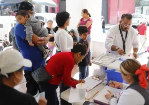 Health worker administering a measles vaccine during a vaccination campaign