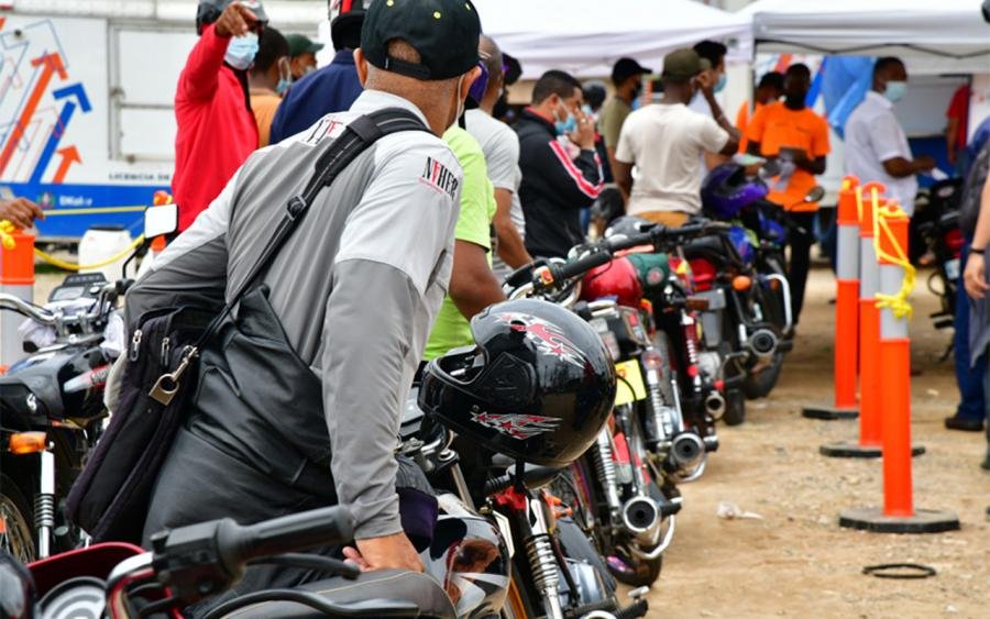 Motoconchistas waiting for passengers near a Metro station in Santo Domingo