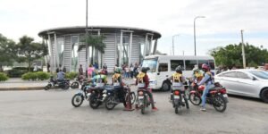 Motoconchistas waiting for passengers at a motorcycle taxi stand in Santo Domingo, Dominican Republic