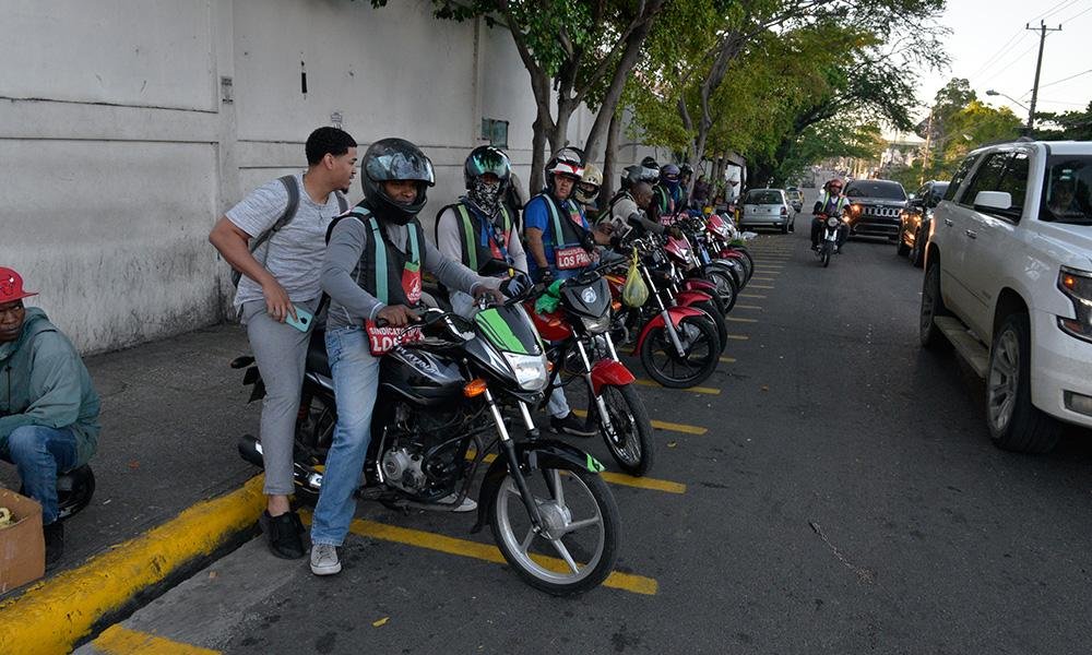 Motoconchistas waiting for passengers near a Metro station in Santo Domingo