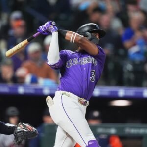 Willi Castro batting for the Colorado Rockies at Coors Field