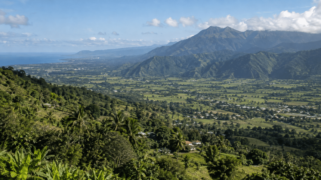 Dominican Republic landscape showing a tropical valley rising toward the mountains of the Cordillera Central
