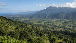 Dominican Republic landscape showing a tropical valley rising toward the mountains of the Cordillera Central