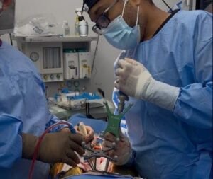 Surgeon performing navigated high-grade scoliosis surgery in the Dominican Republic