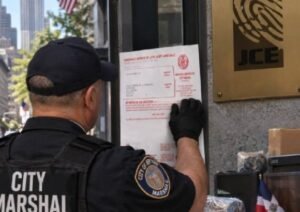 JCE office equipment and property targeted in New York debt enforcement