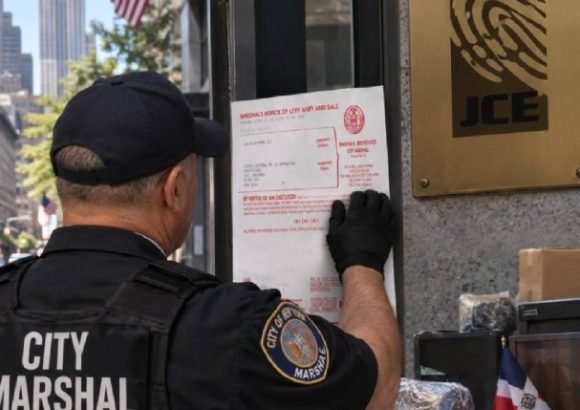 JCE office equipment and property targeted in New York debt enforcement