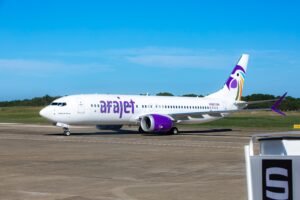 Arajet aircraft representing the Dominican airline's HALLOTRIP promotion offering discounts on international flights