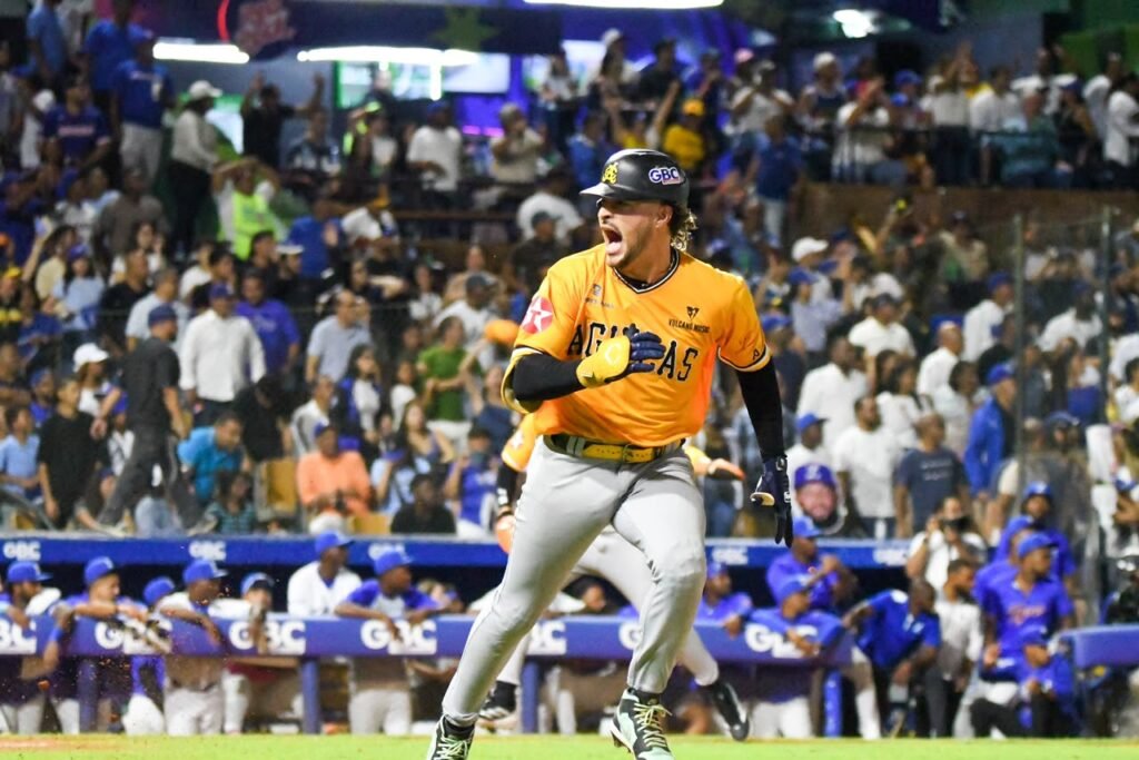 Águilas Cibaeñas celebrate during a Dominican winter baseball game against the Tigres del Licey