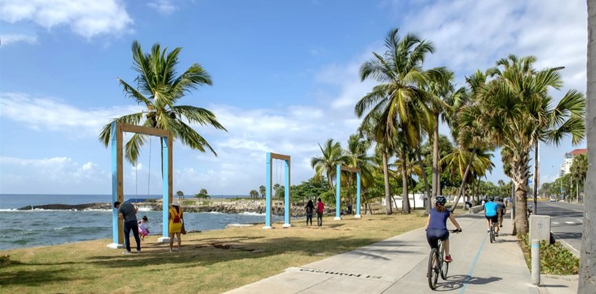 Cyclists exploring Santo Domingo's Malecón and historic neighborhoods on a guided urban bike tour